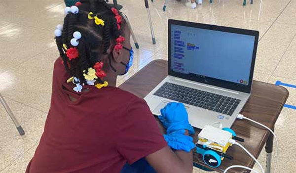 Elementary school students participate in computer science activities as they learn about the digital world.