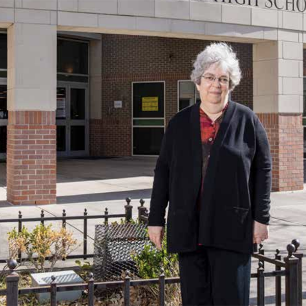 Diane Wofthal in front of Phillis Wheatley High School 