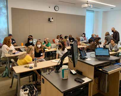 Participants work together in small groups at a workshop during the Houston Climate Summit.