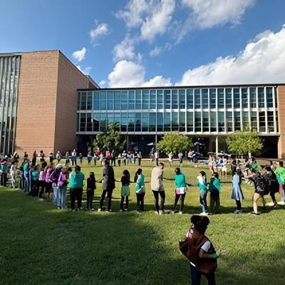 large group of children play outdoors