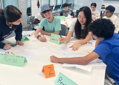 classroom of students at tables