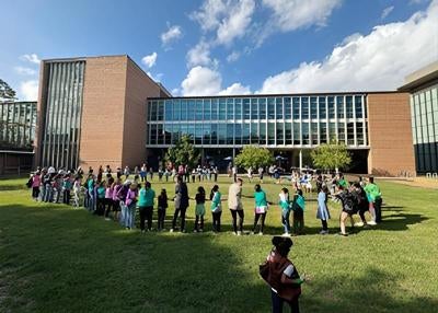 large group of children play outdoors