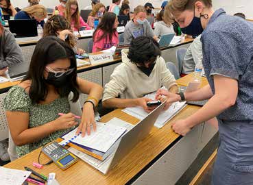 Participants work together with Rice undergraduate Lauren Fraley ’24.