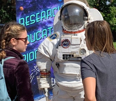 Girls at the STEM festival inquired about how to apply to be an astronaut.