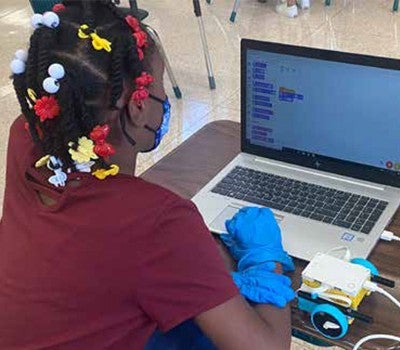 Elementary school students participate in computer science activities as they learn about the digital world.